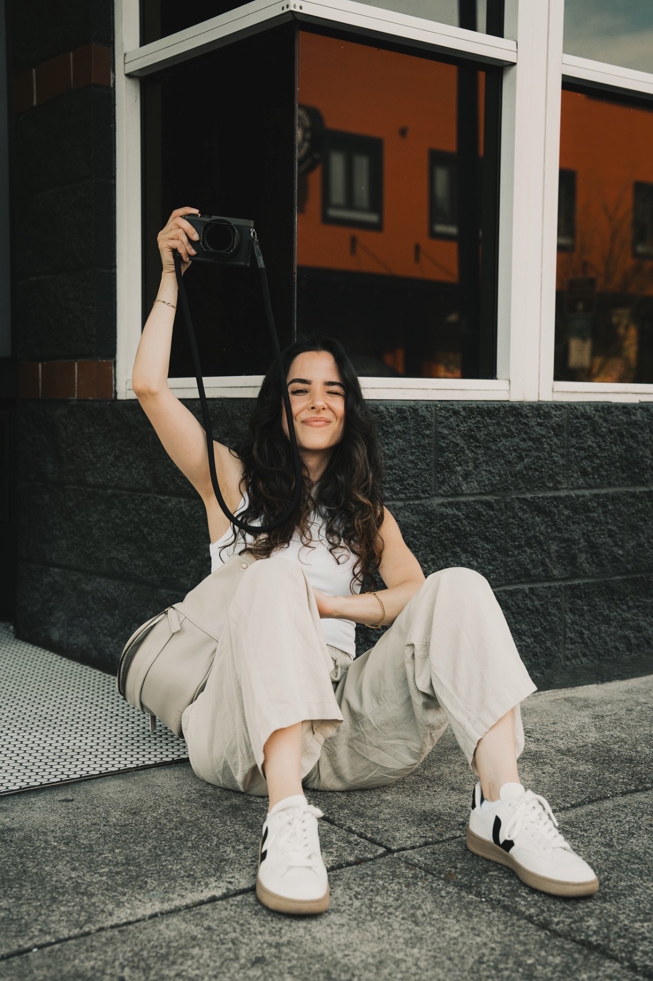 Anaeis Gevorkian seated with her camera